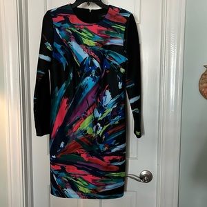 A preowned dress by Maia in size 10. Black with an abstract design. Flawless